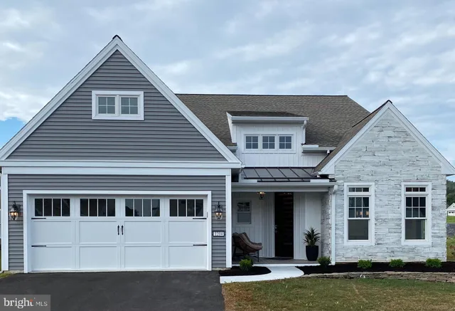 a view of a house with swimming pool and porch