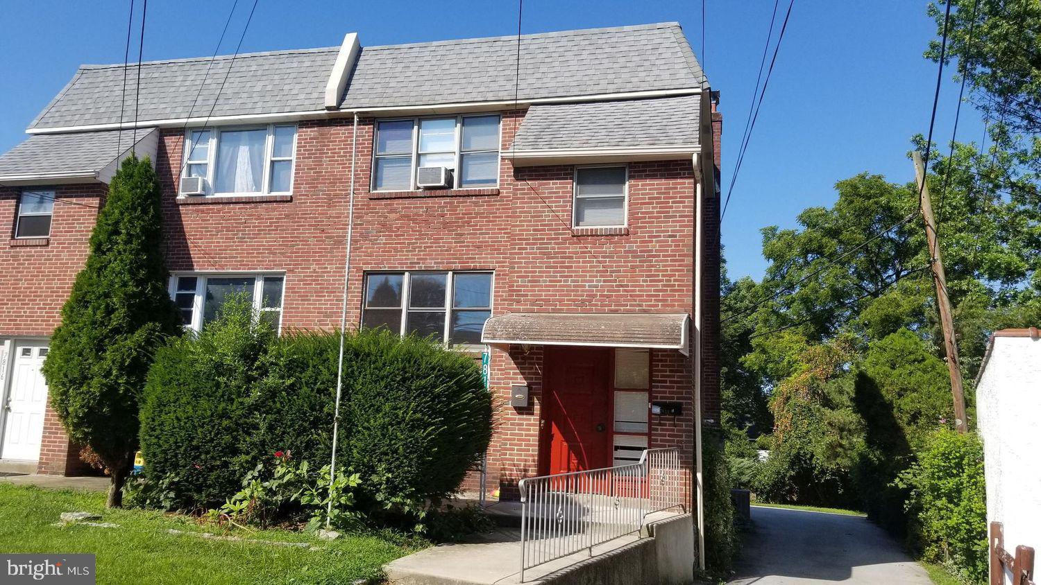 7818 Merion Avenue Upper Darby, PA 19082 - Photo 1 of 11 Charming brick duplex with lush greenery.