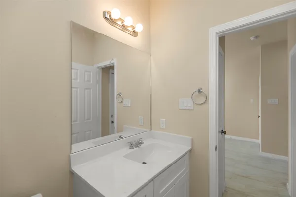 a bathroom with a sink a mirror and a shower