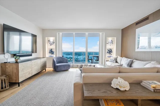 a living room with furniture and a large window