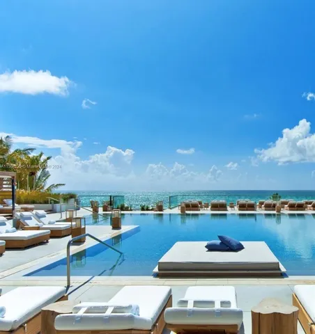 a view of a terrace with seating area and city view