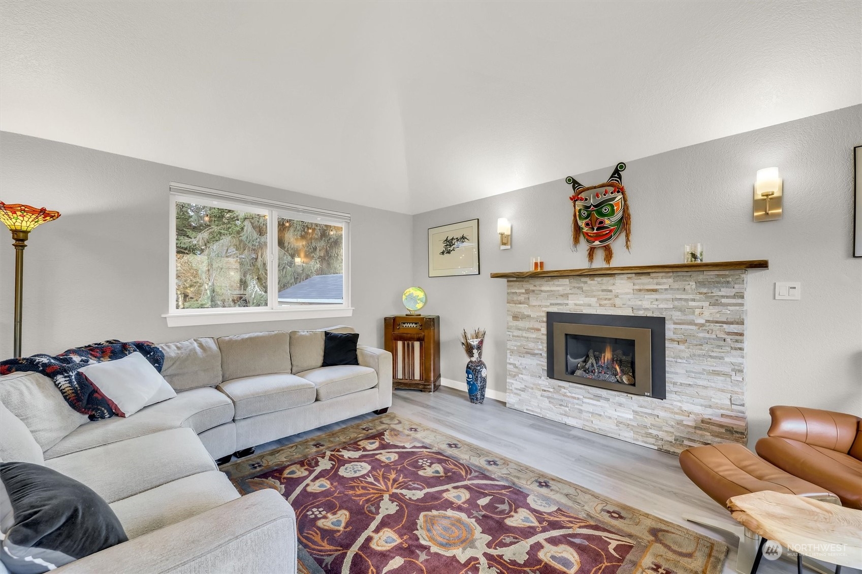 718 198th Place Southeast Bothell, WA 98012 - Photo 3 of 26 a living room with furniture and a fireplace