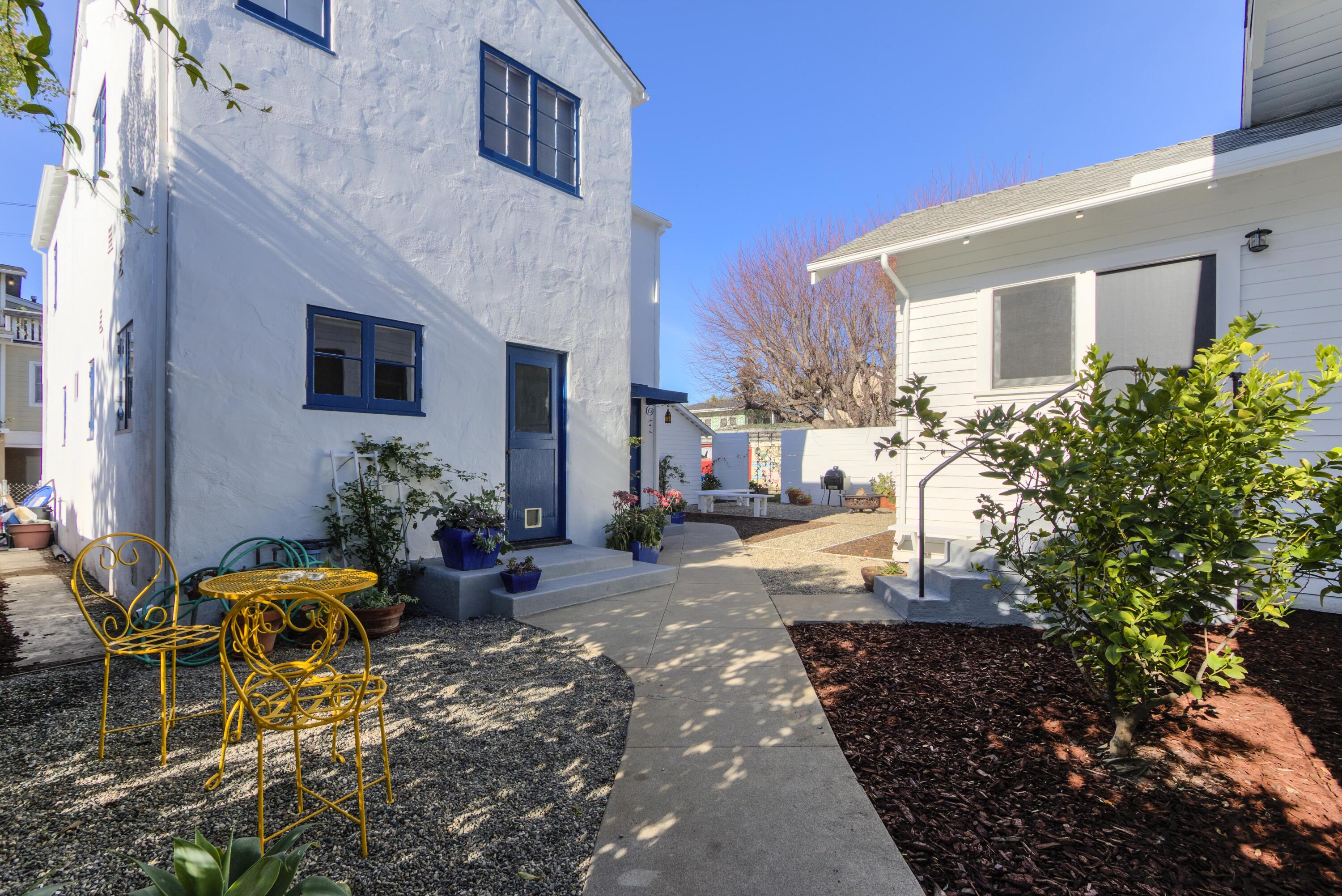 1917 Bath Street Santa Barbara, CA 93101 - Photo 11 of 22 a view of a house with backyard sitting area and garden