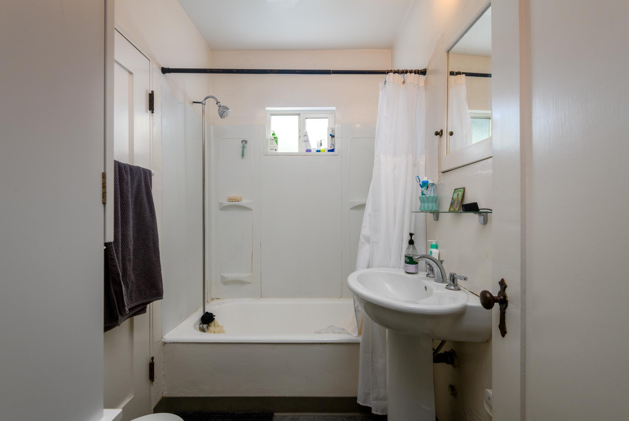 1917 Bath Street Santa Barbara, CA 93101 - Photo 15 of 22 a bathroom with a sink and a mirror