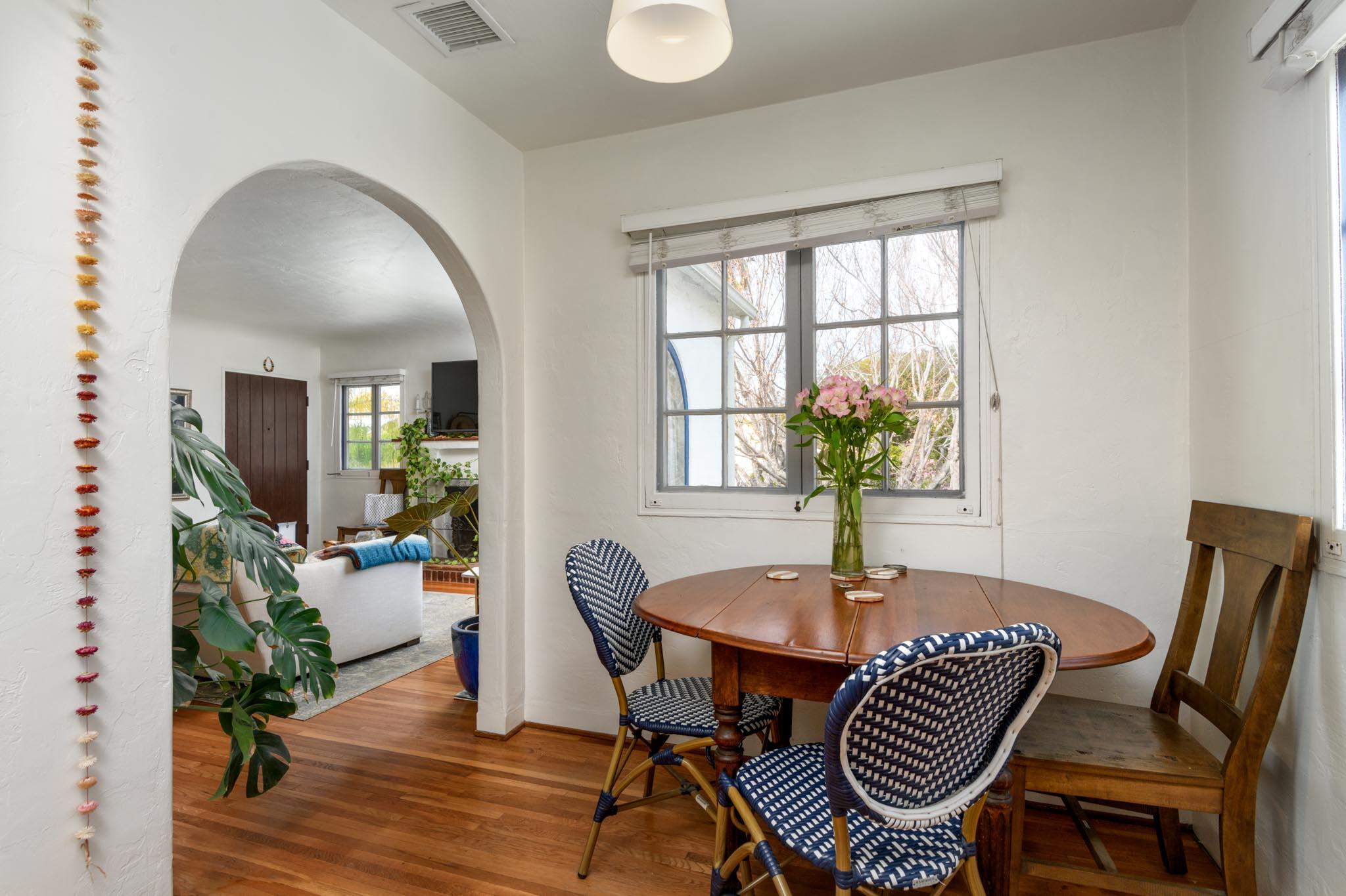1917 Bath Street Santa Barbara, CA 93101 - Photo 18 of 22 a dining room with furniture potted plants and wooden floor