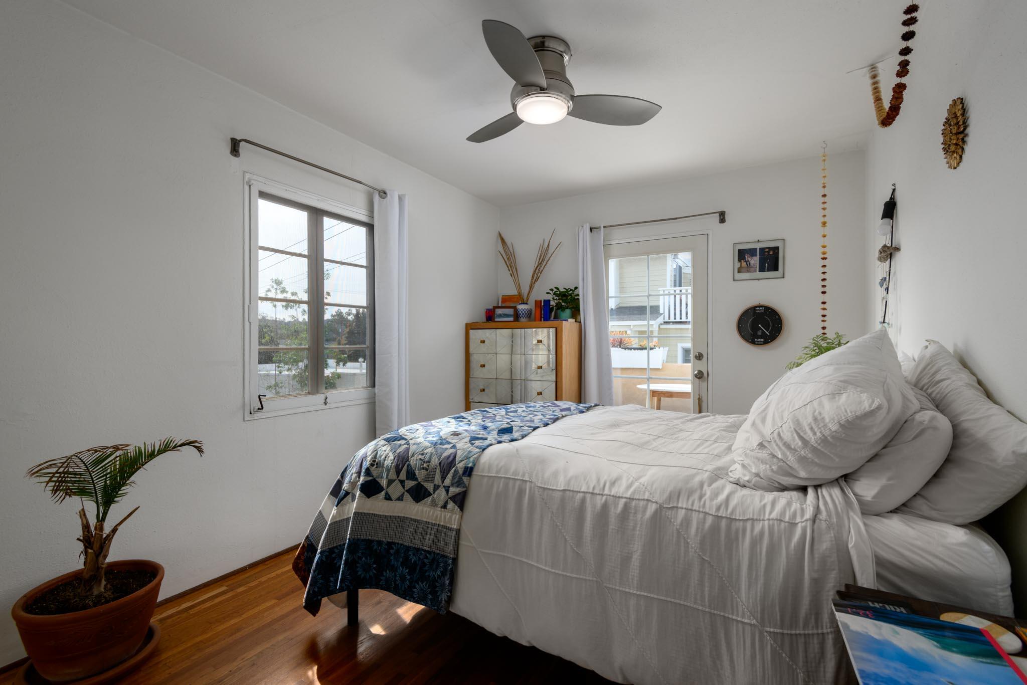 1917 Bath Street Santa Barbara, CA 93101 - Photo 20 of 22 a bedroom with a bed and a potted plant