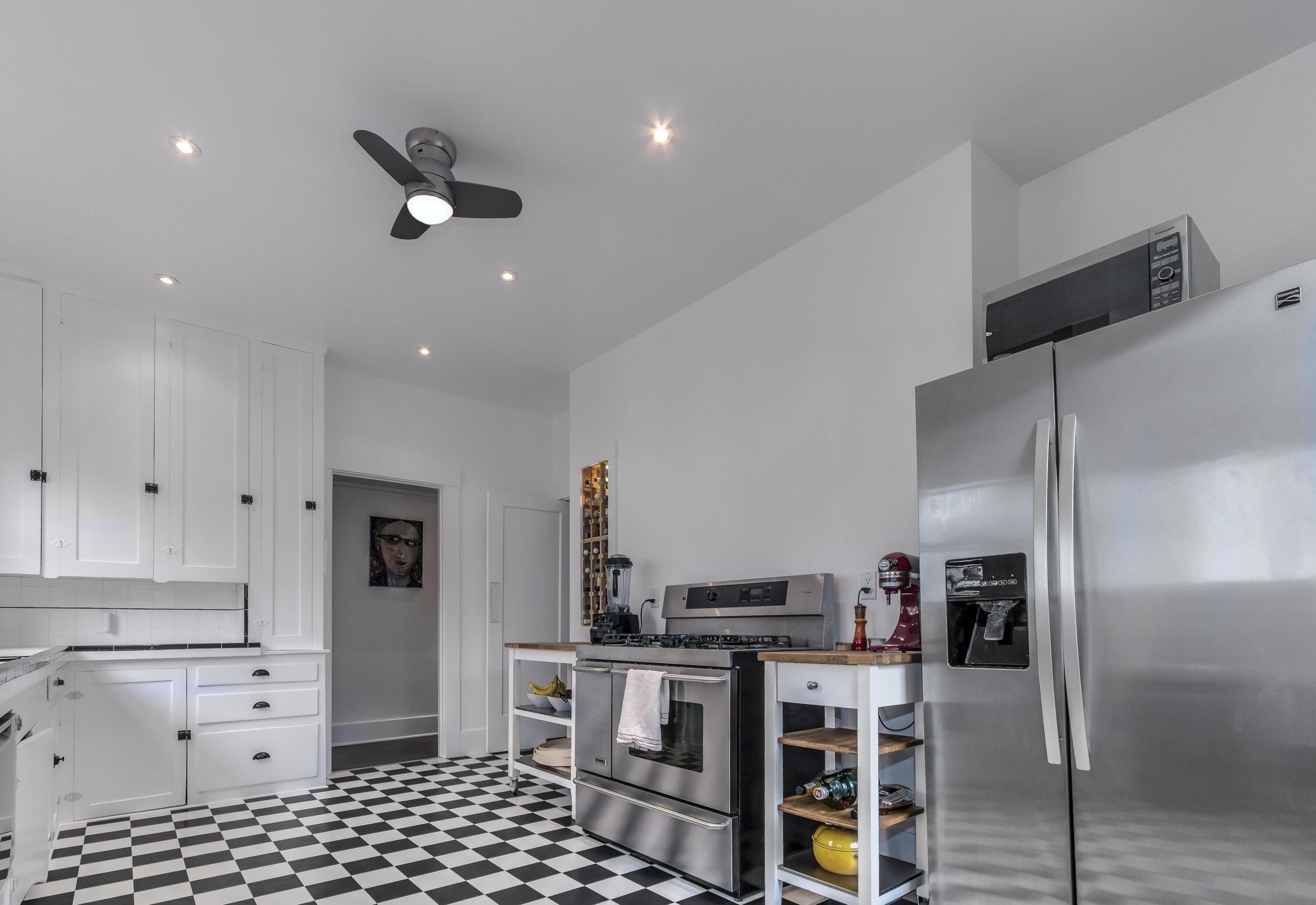 1917 Bath Street Santa Barbara, CA 93101 - Photo 5 of 22 a kitchen with stainless steel appliances kitchen island granite countertop a refrigerator and a stove top oven