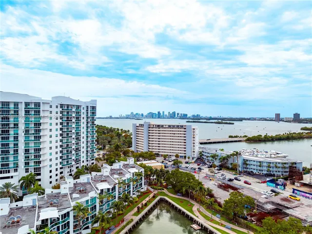 a view of a lake with tall buildings