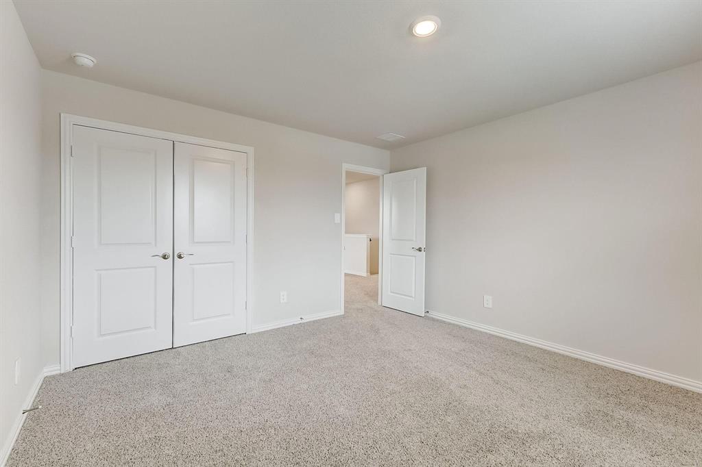 1405 Winters Way McKinney, TX 75071 - Photo 23 of 32 Unfurnished bedroom featuring carpet floors and a closet