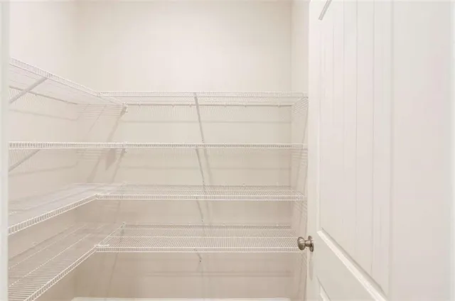 a view of a room with racks on the wall