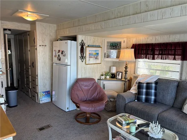 a kitchen with stainless steel appliances granite countertop a stove and a microwave