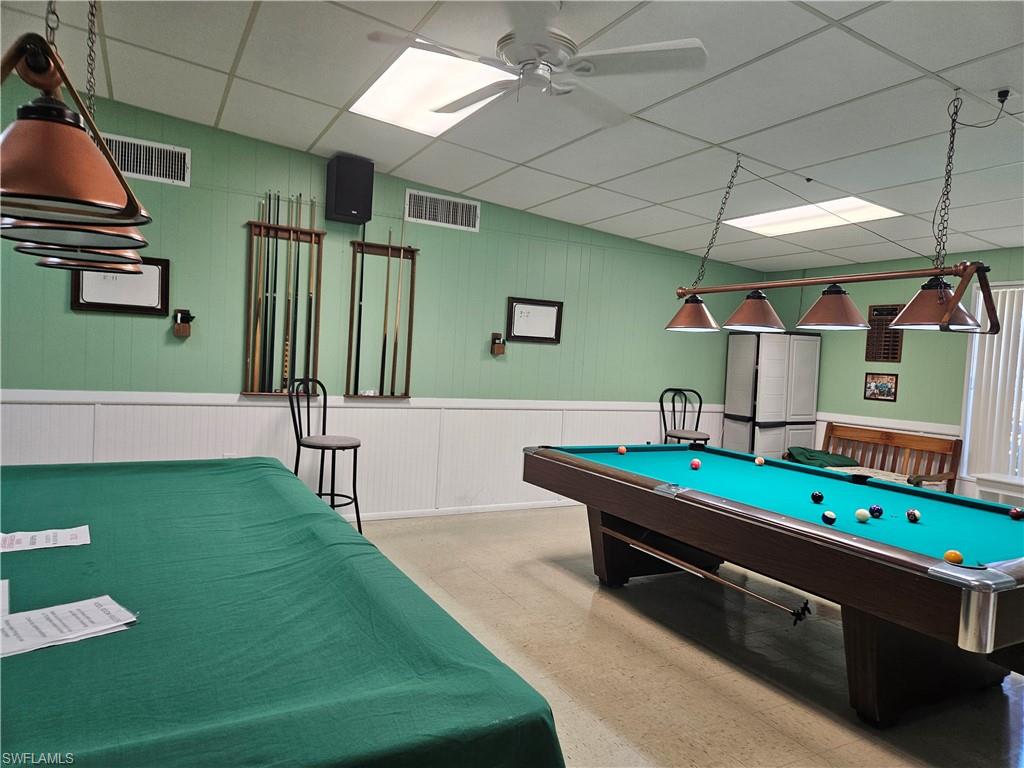 9 Jade Drive, Unit 9J Naples, FL 34114 - Photo 26 of 28 a room with pool table and windows