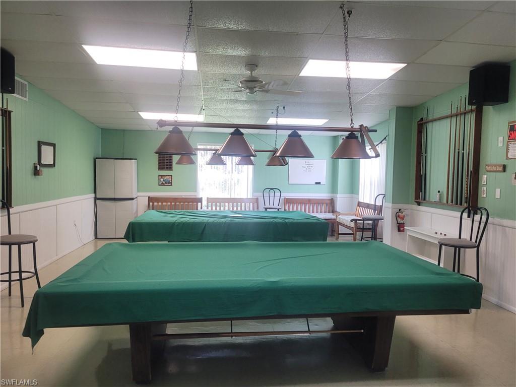 9 Jade Drive, Unit 9J Naples, FL 34114 - Photo 28 of 28 a room with pool table and windows