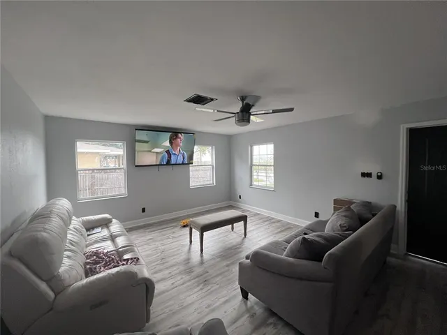 a living room with furniture and a window