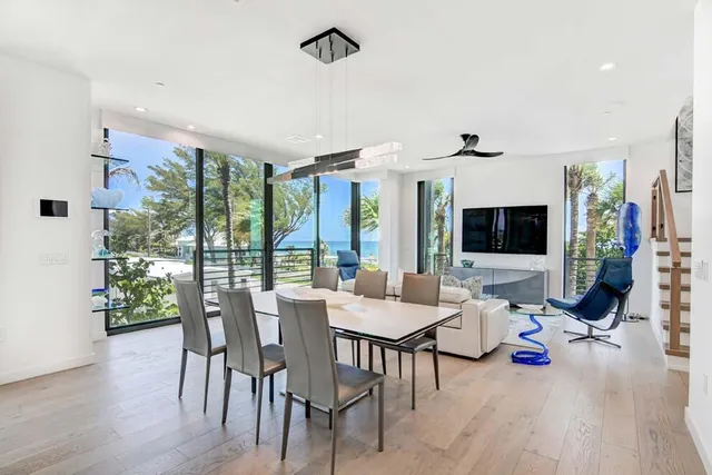 a view of an entryway with wooden floor and windows