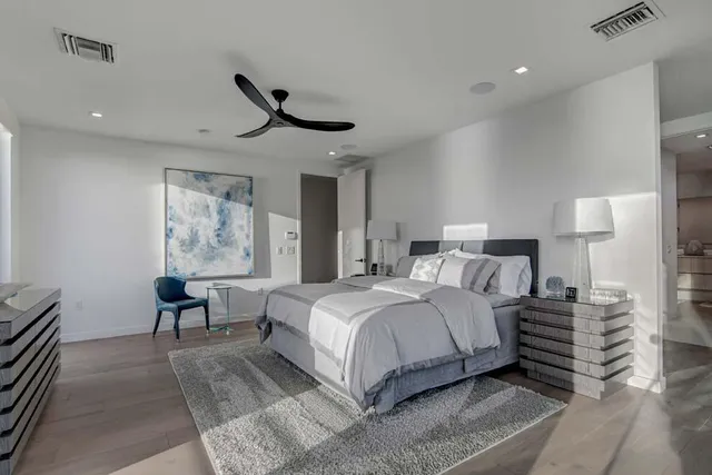a bathroom with a shower sink and mirror