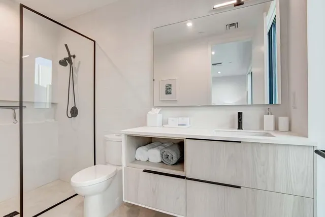 a bed room with a bed and a potted plant