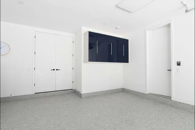 a kitchen with a refrigerator and a cabinets