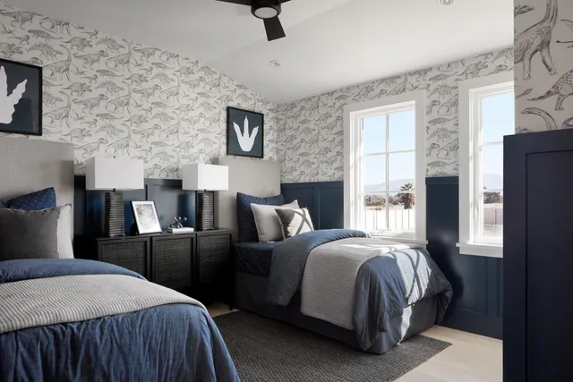 a bedroom with a bed and a refrigerator