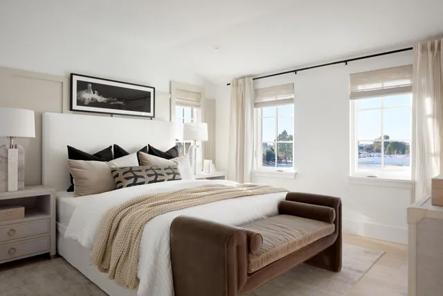 a bedroom with bed and a window