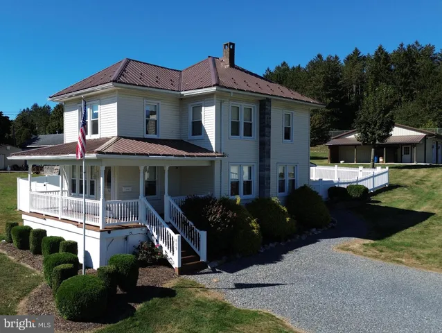 a front view of a house with a porch