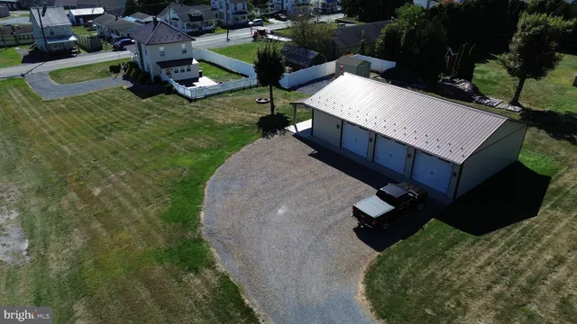 an aerial view of a house having yard