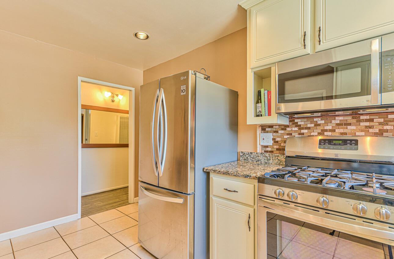 26 Young Drive Salinas, CA 93901 - Photo 12 of 28 a kitchen with stainless steel appliances granite countertop a refrigerator and a stove