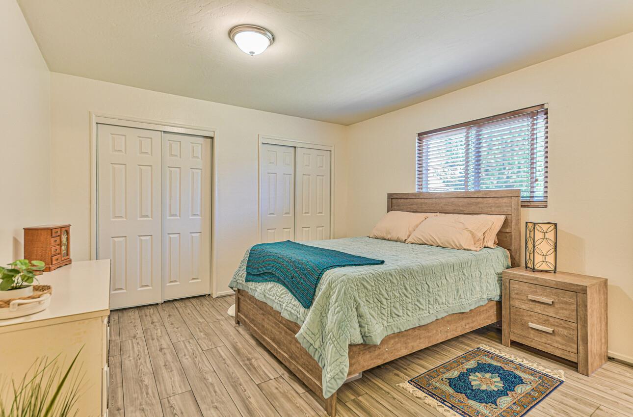 26 Young Drive Salinas, CA 93901 - Photo 15 of 28 a bedroom with a bed and wooden floor