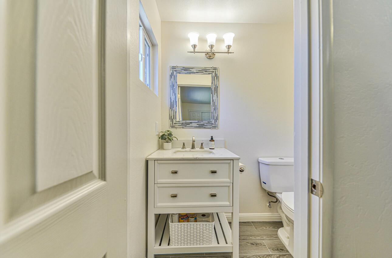 26 Young Drive Salinas, CA 93901 - Photo 18 of 28 a bathroom with a sink mirror and a toilet