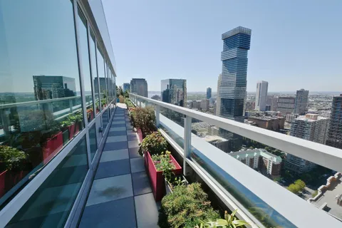 a city view from a balcony with outdoor space