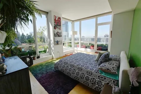 a living room with couch and a large window