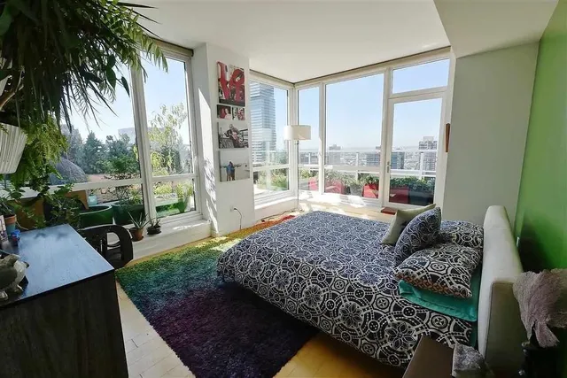 a living room with couch and a large window