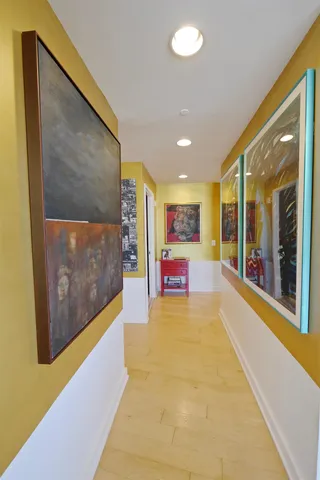 a view of an entryway with wooden floor