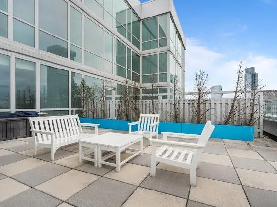 a view of a patio with a table and chairs
