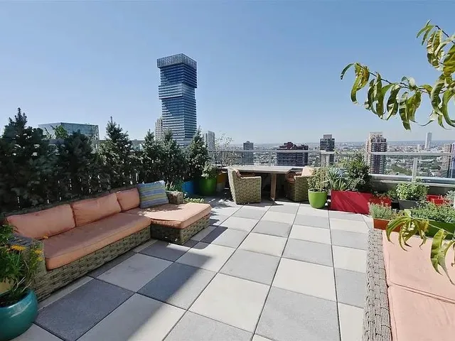 a view of a terrace with furniture and potted plants