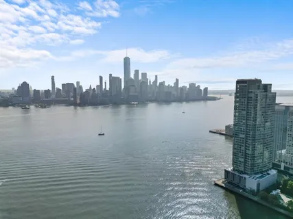 a view of a lake with building in front of it