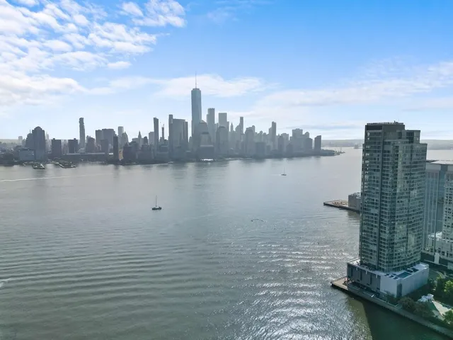 a view of a lake with building in front of it