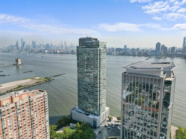 a view of a city with tall buildings