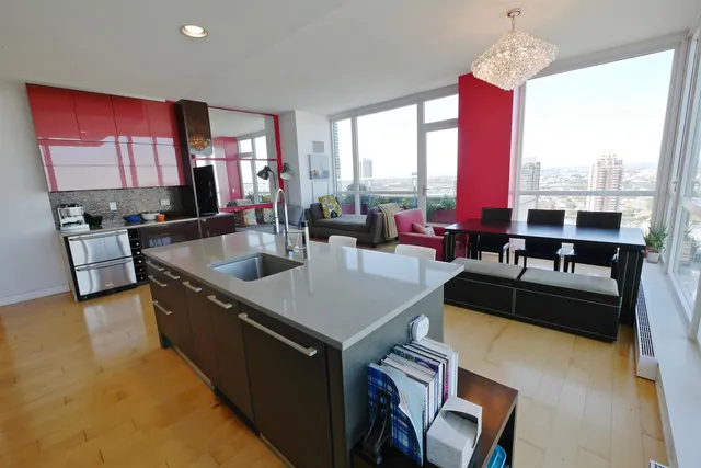 a very nice looking living room with a large window and a flat screen tv