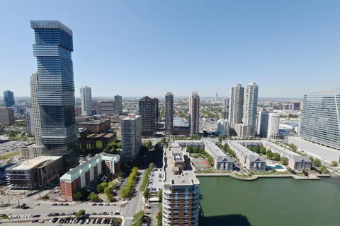 a view of city with ocean
