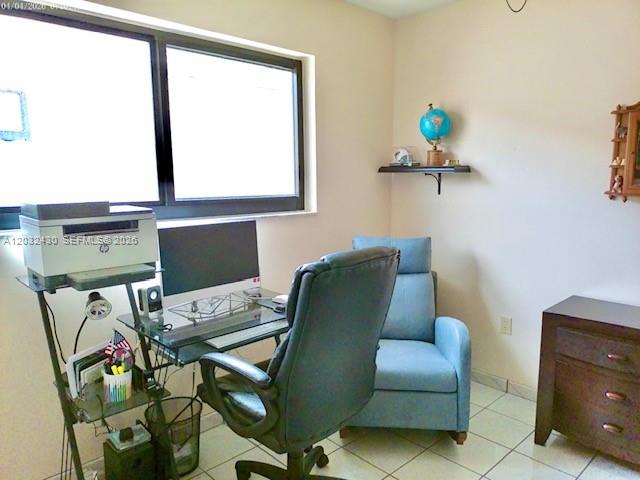 6527 West 22nd Lane Hialeah, FL 33016 - Photo 15 of 18 a work room with furniture and a window