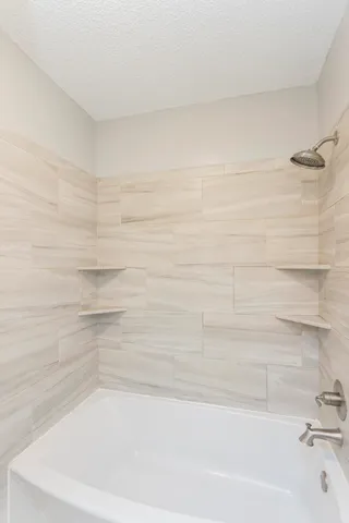 a bathroom with a bathtub