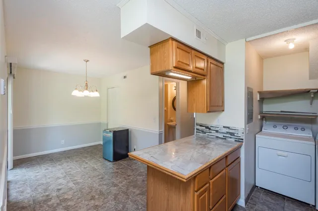 a kitchen with a stove and a refrigerator