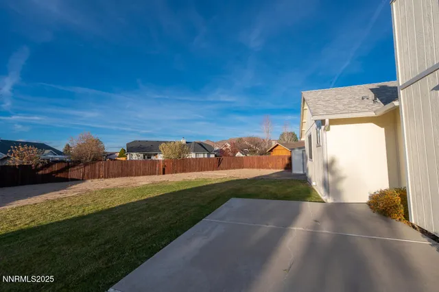 a view of a back yard of the house