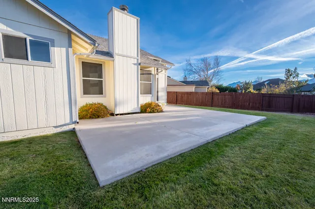 a view of a patio with a yard