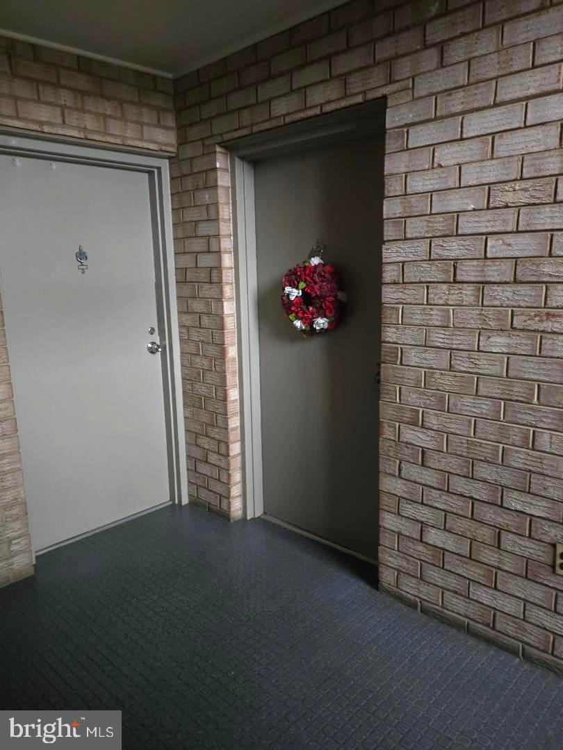 214 Locust Street Southeast, Unit 121 Vienna, VA 22180 - Photo 3 of 18 Entrance to Condo