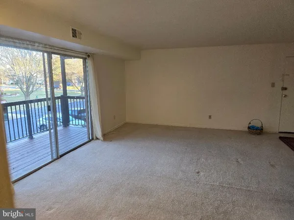 a view of a room with large windows
