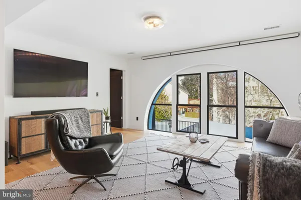 a living room with a couch and a large window