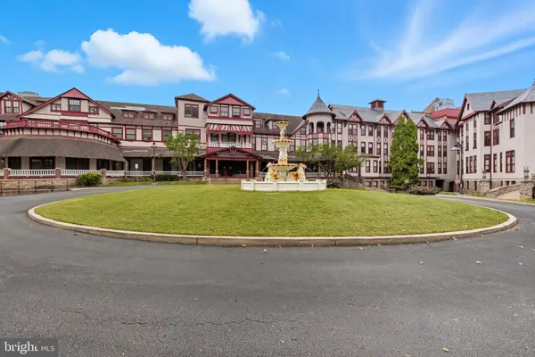 a view of a livingroom with furniture and a flat screen tv
