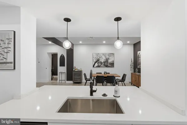 a view of a living room and a chandelier